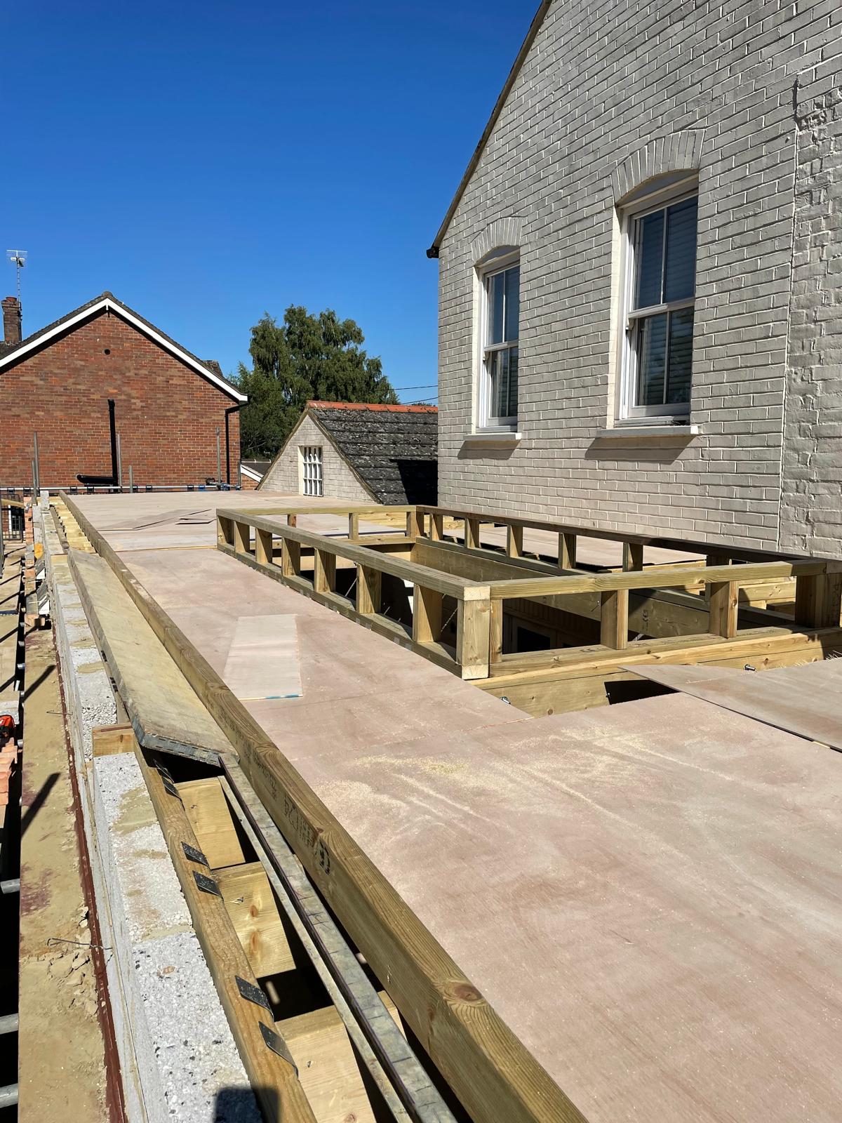 First floor joists and decking laid over a new two-storey extension by DBD Builders Ltd