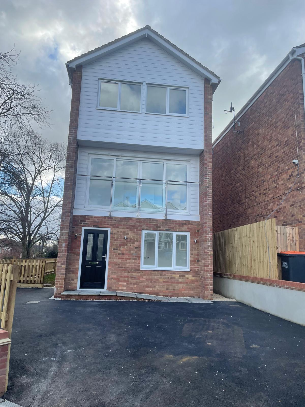 Detached house with brick and cladding elevations and new tarmac driveway completed by DBD Builders Ltd