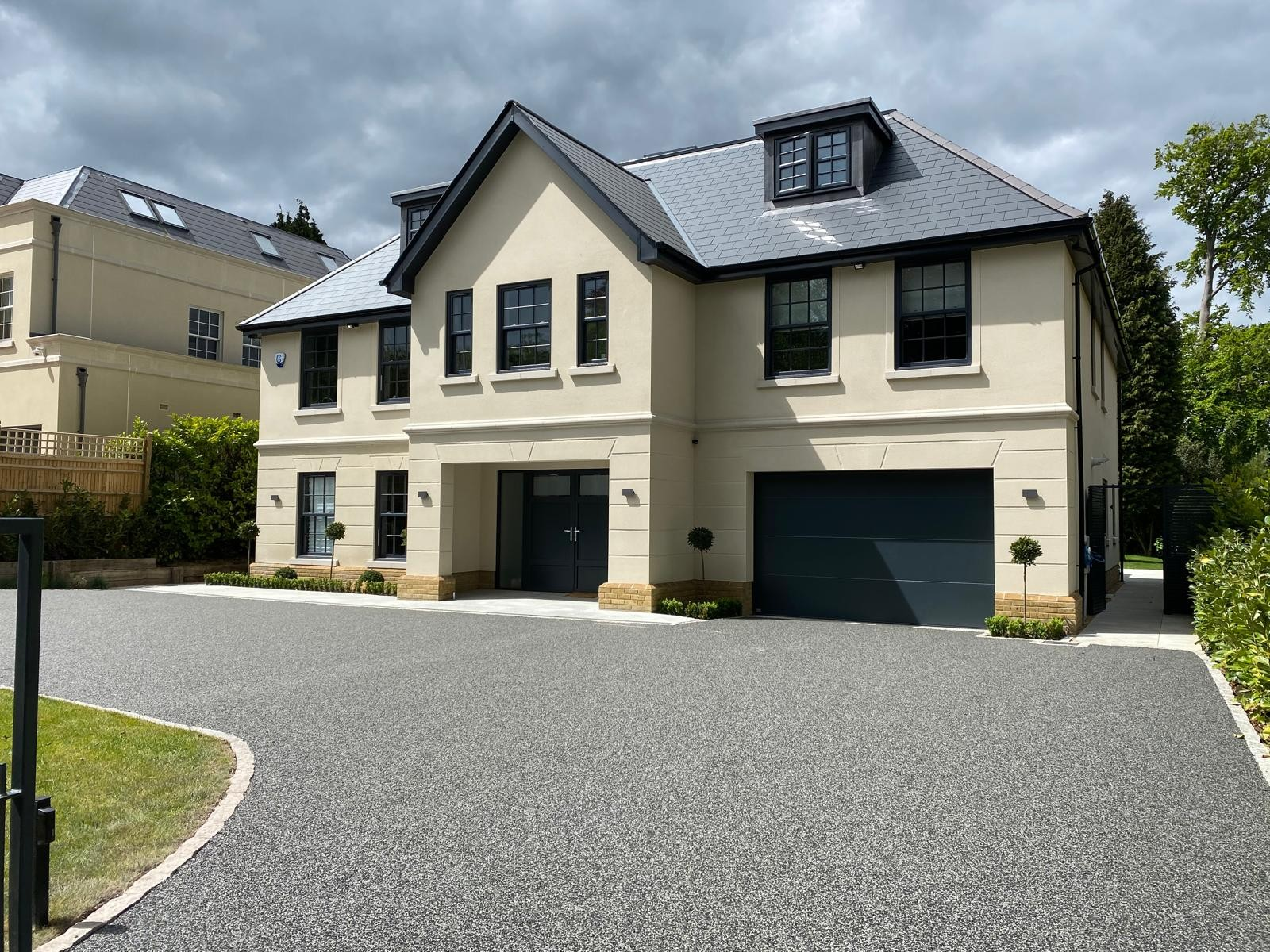 Completed new build detached house with rendered elevations, slate roof and resin bound driveway by DBD Builders Ltd