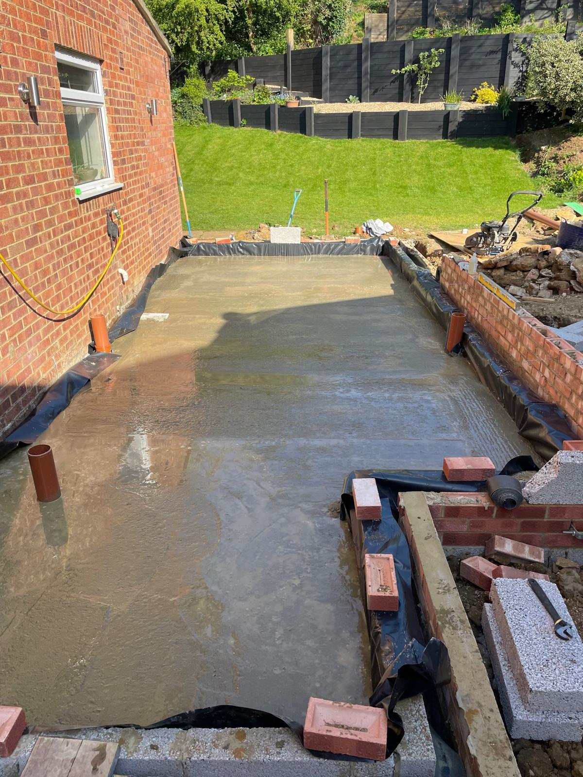 Finished concrete slab with damp proof membrane and drainage for a rear extension by DBD Builders Ltd
