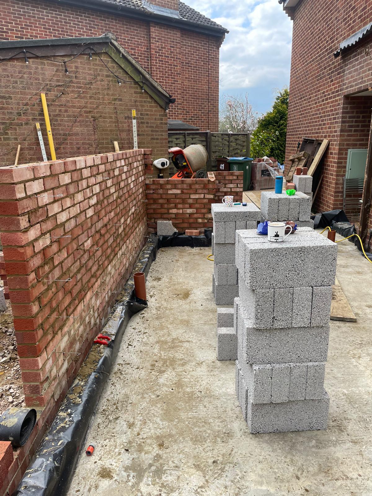 Facing brickwork and blockwork raised off a new concrete slab for a side extension by DBD Builders Ltd