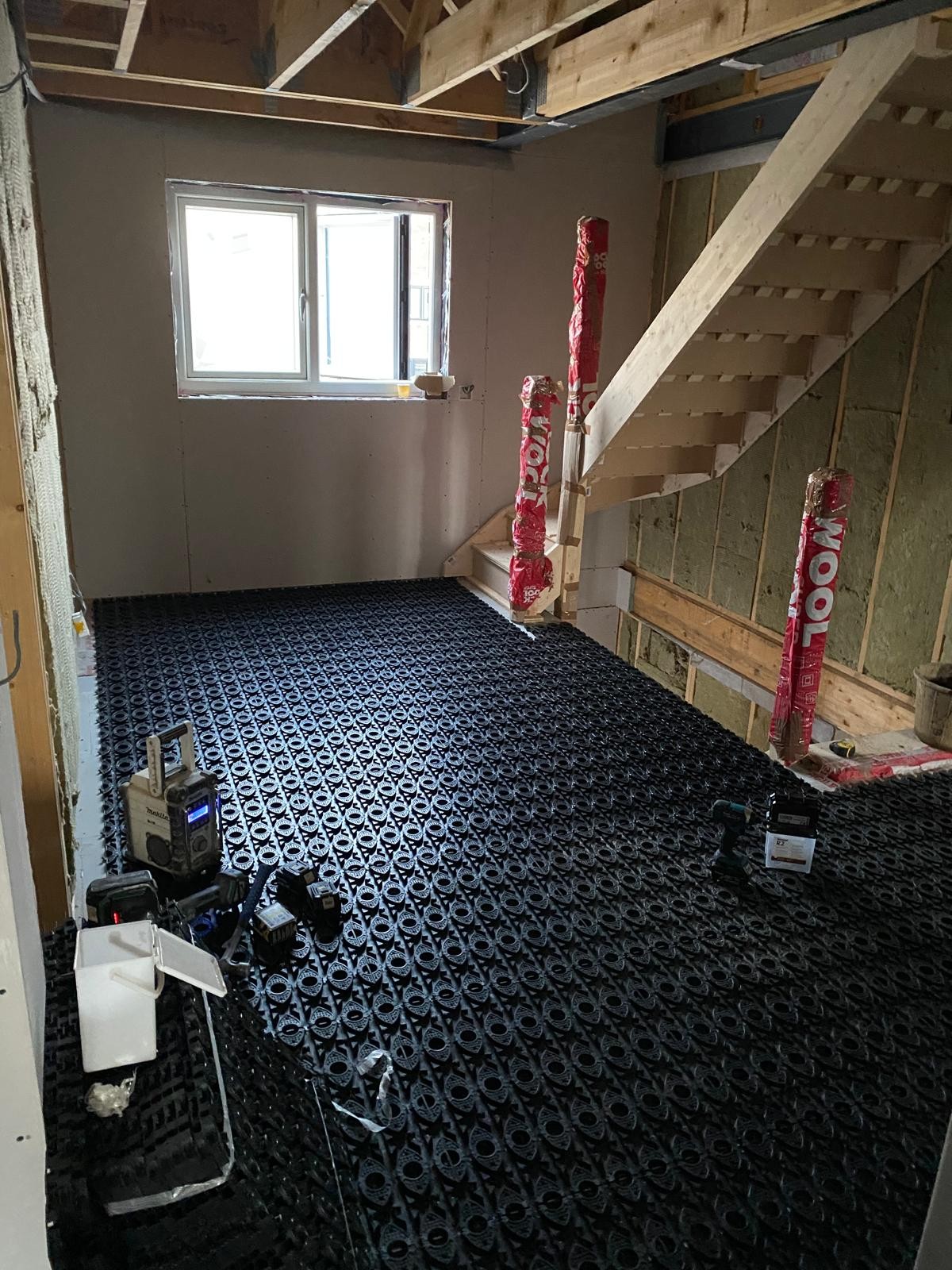 Wet underfloor heating pipework clipped over insulation by DBD Builders Ltd